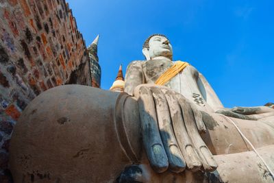 Low angle view of statue against sky