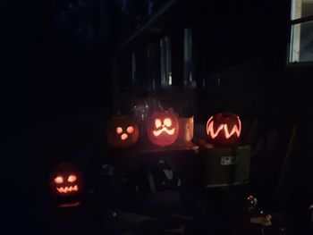 Close-up of illuminated red pumpkin at night