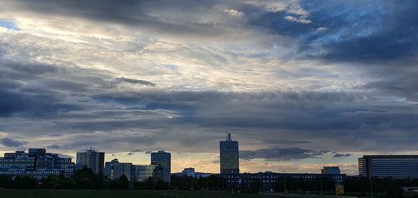 Modern buildings in city against sky