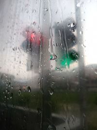 Full frame shot of wet glass window in rainy season