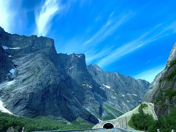 Panoramic view of mountains against blue sky