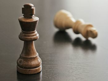 Close-up of chess pieces on table