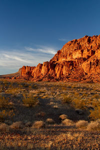 Rock formations on landscape against sky