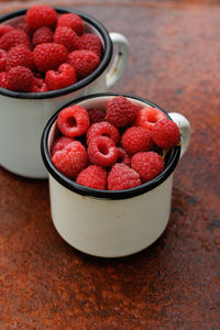 High angle view of strawberries in container on table