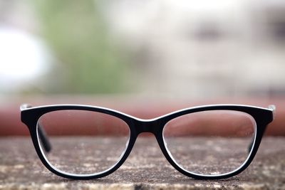 Close-up of sunglasses against sky