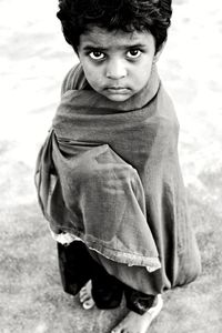 Portrait of boy standing outdoors