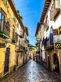 Narrow alley amidst buildings in city