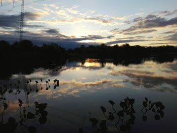 Scenic view of lake against sky during sunset