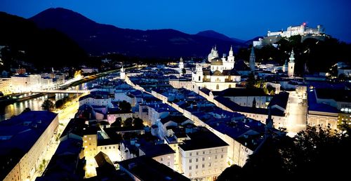 High angle view of buildings in city at night