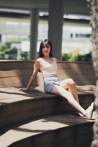 Portrait of woman sitting outdoors