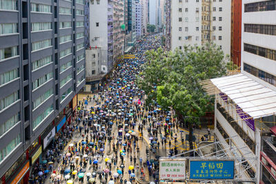 High angle view of crowd on street amidst buildings