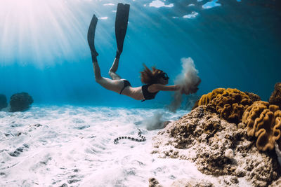 Full length of woman swimming in sea