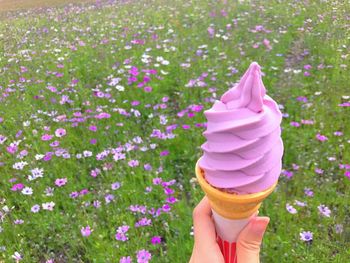 Close-up of hand holding ice cream