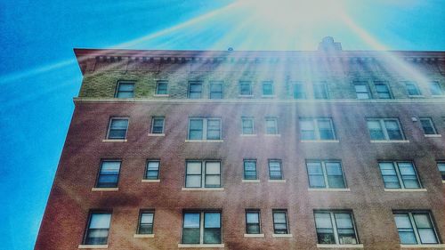 Low angle view of buildings against blue sky