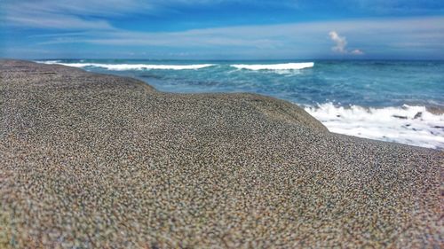 Scenic view of beach against sky