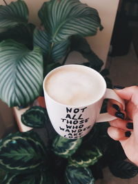 Midsection of woman holding coffee cup