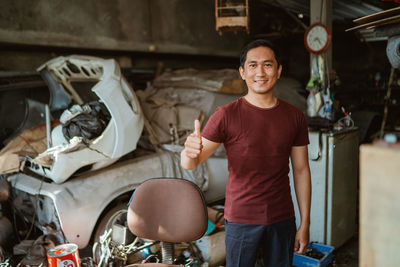 Portrait of young man working at construction site