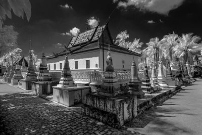 Panoramic view of temple and building against sky