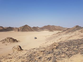 Scenic view of desert against clear sky