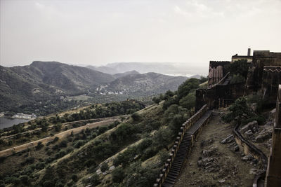 High angle view of castle on mountain against sky in jaipur