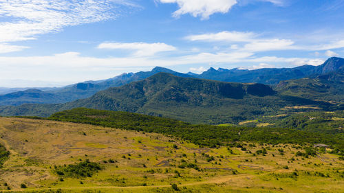 Mountains covered rainforest, trees and blue sky with clouds. riverston, sri lanka.