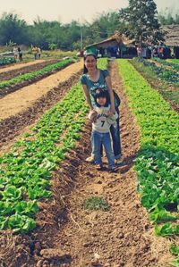 Portrait of boy standing in farm