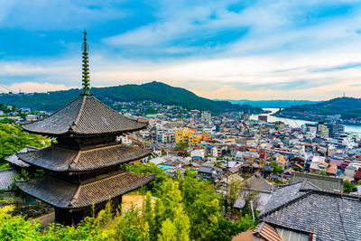 High angle view of temple in city against sky