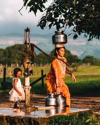 Portrait of child standing by water