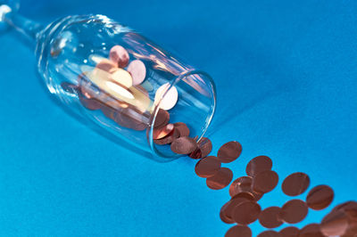 Close-up of blue glass on table