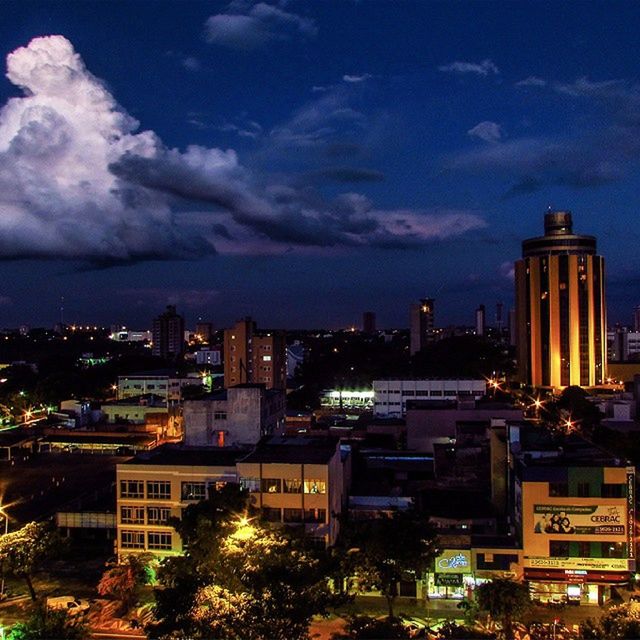 building exterior, architecture, built structure, city, cityscape, sky, cloud - sky, tower, illuminated, residential building, residential district, cloudy, crowded, high angle view, skyscraper, tall - high, cloud, dusk, city life, residential structure