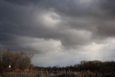 Storm clouds over field