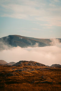 View of landscape against cloudy sky