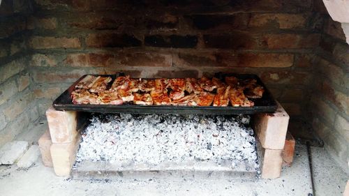 Close-up of meat on barbecue grill