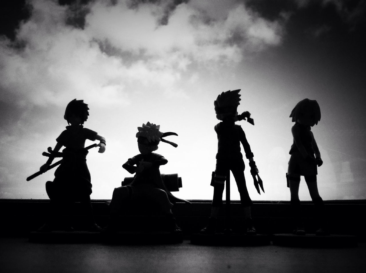 sky, lifestyles, togetherness, men, silhouette, leisure activity, full length, cloud - sky, bonding, low angle view, standing, boys, childhood, love, human representation, friendship
