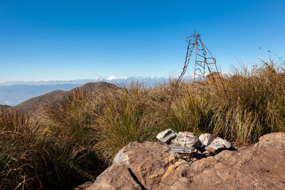 Scenic view of land against clear blue sky