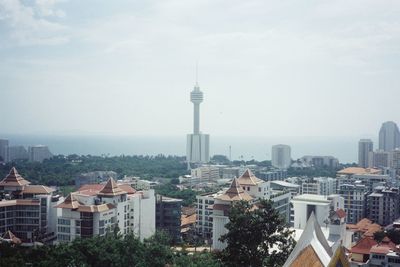 Buildings in city against sky