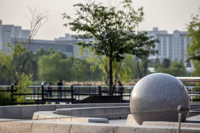 Sphere shaped stone at park in city