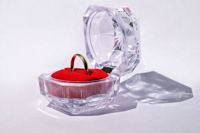 Close-up of heart shape on table against white background