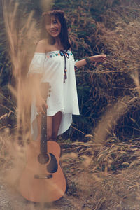 Young woman standing on field