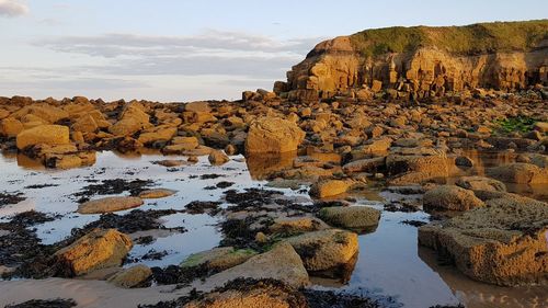 Scenic view of rock formations against sky