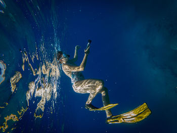 Woman swimming in sea