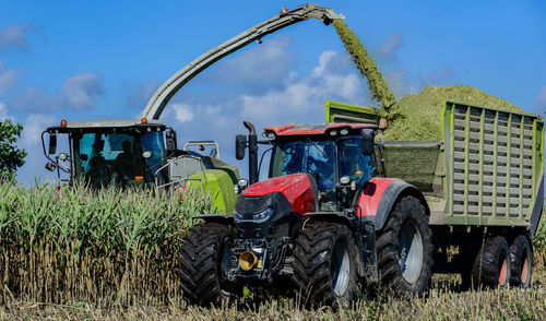 Tractor on field against sky