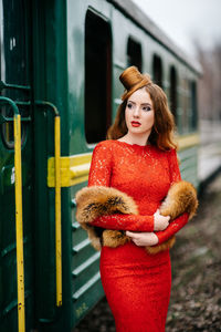 Portrait of young woman standing outdoors