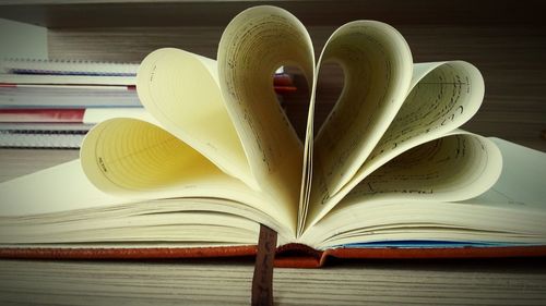 Close-up of heart shape book on table