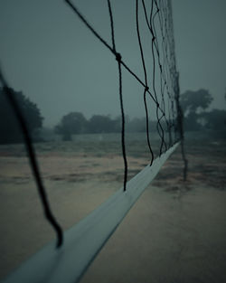 Close-up of car on land against sky