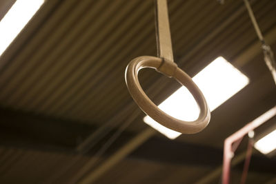 Close-up of gymnastic rings hanging from ceiling