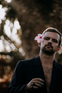 Portrait of young man looking at camera