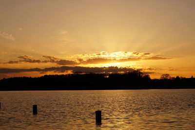 View of calm lake at sunset