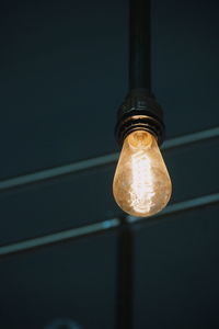 Low angle view of illuminated light bulb