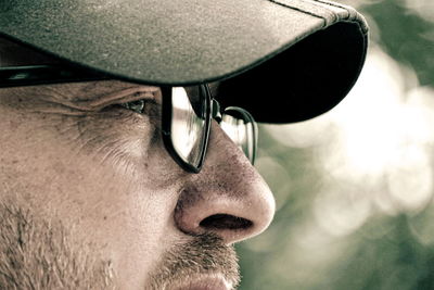 Close-up portrait of man wearing hat